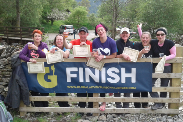 Three Peaks Challenge finishers - smiling people.